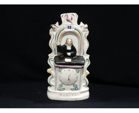     A Staffordshire Pottery Portrait Figure Of Wesley In A Pulpit                   