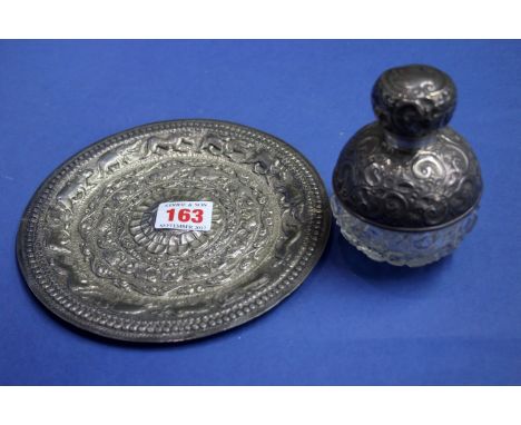 A silver mounted cut glass globular scent bottle, by Henry Wilkinson & Co, London 1914, having chased foliate scroll decorati