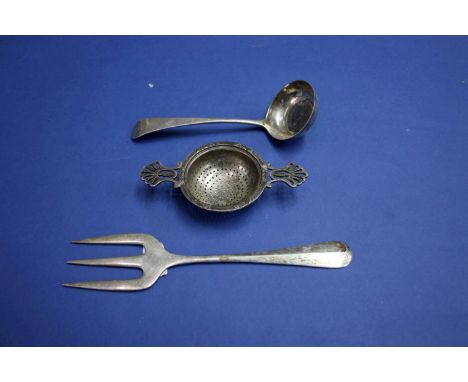 A silver bread fork, by Atkin Brothers Ltd, Sheffield 1920; together with a George III silver sauce ladle and a silver tea st