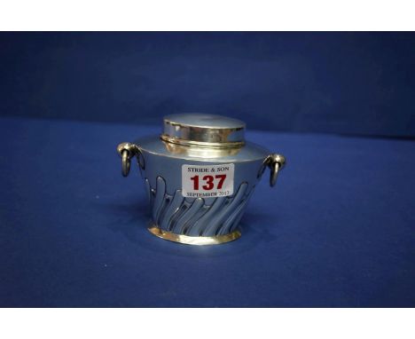 An Edwardian silver tea caddy, by W Hutton & Sons Ltd, Birmingham 1910, 7cm, 115g and a silver napkin ring.