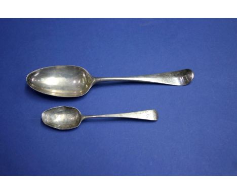 An 18th century silver Old English pattern table spoon and a Georgian silver tea spoon, 89g.