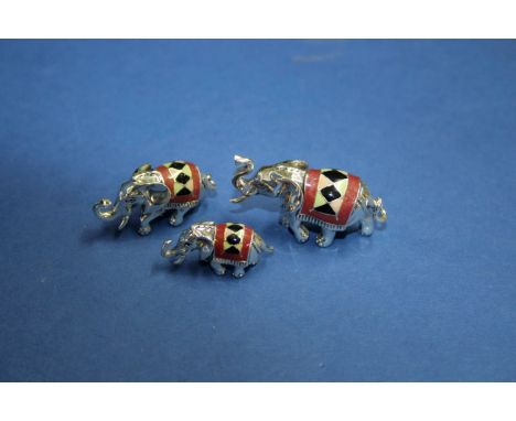 A Saturno sterling silver and enamel miniature three piece elephant family, largest 2.2cm.   Condition Report:  No damage see