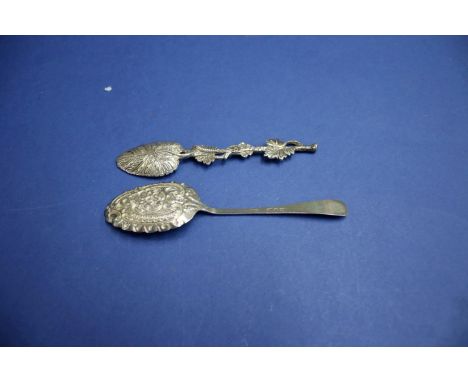 A silver leaf spoon and one other.