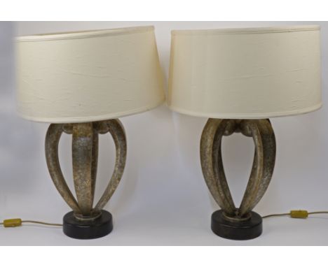 A pair of modern scroll form table lamps, retailed by Fine Art Lamps Miami, each on a black circular base, 49cm high exc. fit