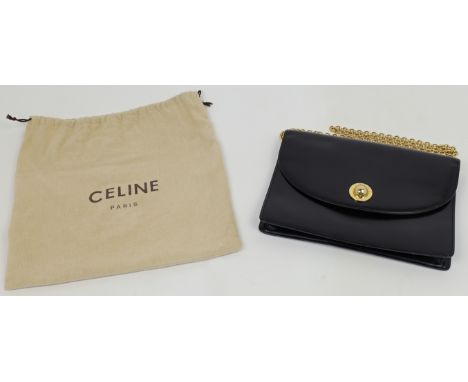 A Céline Paris black leather shoulder bag, c.1970s, gold hardware, with star ball logo inscribed CELINE PARIS to the magnetic