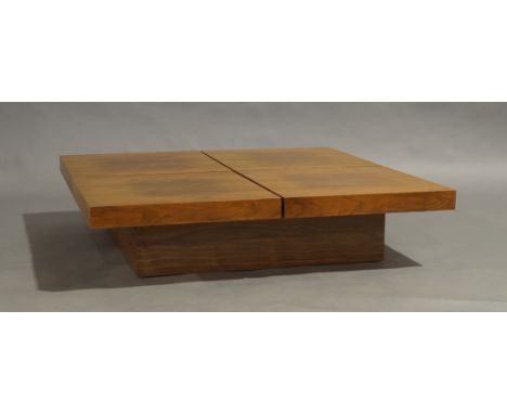 A Contemporary walnut veneered low coffee table, with sliding mechanism enclosing storage compartment, 26cm high, 111cm wide,