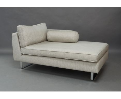 A modern chaise lounge, with grey and cream check fabric, raised on chrome supports, reputedly from Heal's, 66cm high, 151cm 