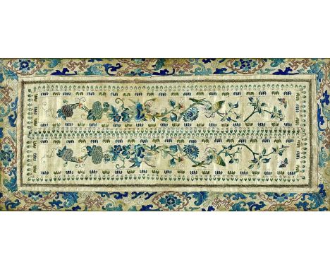 A Chinese silk embroidered panel mounted in a tray, late 19th century. 58 x 27cm.some staining