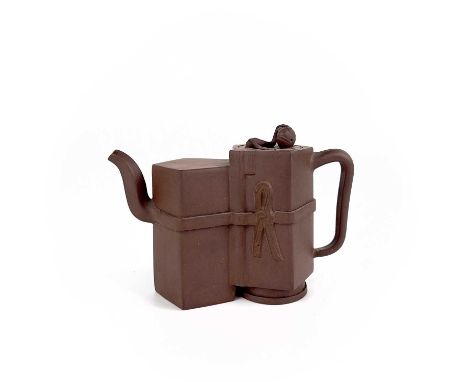 A Chinese Yixing teapot. The circular cover surmounted by fruit, height 11cm, length 17cm.Lid chips. See images