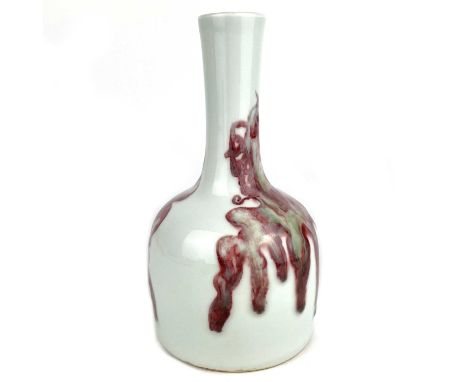 A Chinese porcelain mallet shaped vase, 20th century. Enamelled with iron red archaic stylised phoenix, blue six character ap