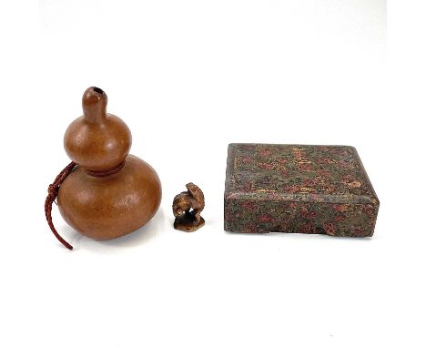 A Japanese boxwood netsuke of toads on a lily pad Meji period. Height 5cm together with a double gourd water carrier, and a J
