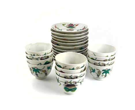 Twelve Chinese famille rose porcelain tea bowls and saucers, 19th century. Decorated with crabs and others with leafy vines, 