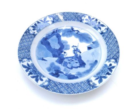 A Chinese porcelain blue and white porcelain dish, Kangxi period. With figures in a landscape, four character mark and attach
