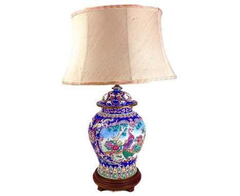 A 20th century canton enamel lamp base decorated with birds within cartouches.  Height 43cm.