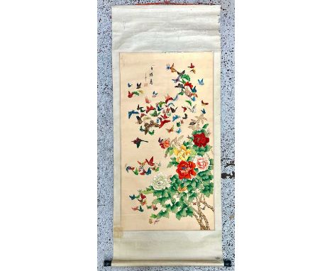 A Chinese watercolour and ink scroll painting. Decorated with a kaleidoscope of butterflies and flowers, image size 115cm x 5