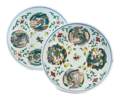 A near pair of Chinese wucai porcelain plates. blue Qianlong seal mark, each with painted enamel roundels of dragons and phoe