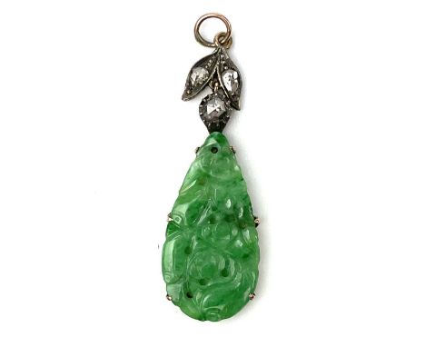 A Chinese green jade and diamond set pendant. The gold mounted pear shaped carved and pierced jade foliate decorated, surmoun