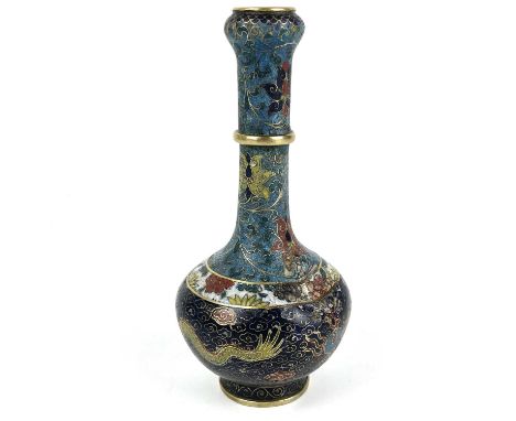 A Chinese cloisonné enamel vase, 19th century, signed. Decorated with a dragon, height 14.5cm, width 6.5cm.large dent and min