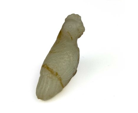 A Chinese carved jade and russet chicken, Qing Dynasty. Height 3.5cm, length 4.5cm, depth 1.8cm.From the estate of Frederic L