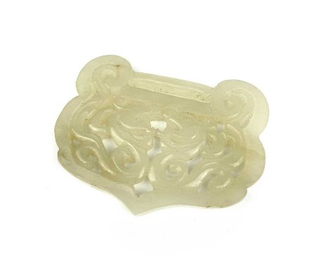 A Chinese carved pale jade buckle, Qing Dynasty. 6 x 5cm.From the estate of Frederic Lipscombe.Frederic Lipscombe was an arti