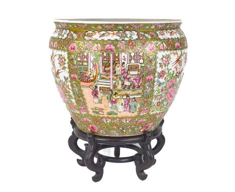 A large Chinese Canton porcelain fish bowl jardiniere on stand, 20th century. Height of bowl 40cm, diameter 48cm.Some gilding