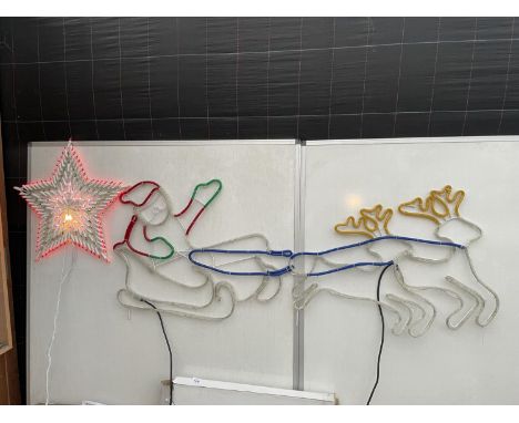 A BOXED STAR GLOW TUBELIGHT DECOR LIGHT DISPLAY OF SANTA AND HIS SLEIGH AND A FURTHER STAR LIGHT UP DECORATION BOTH BELIEVED 
