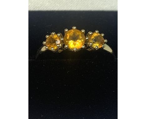 A 9 CARAT GOLD RING WITH THREE IN LINE CITRINES SIZE R IN A PRESENTATION BOX 