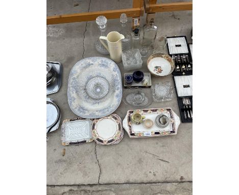 AN ASSORTMENT OF ITEMS TO INCLUDE A LARGE BLUE AND WHITE MEAT PLATE, CUT GLASS DECANTORS AND FURTHER CERAMIC PLATES ETC 