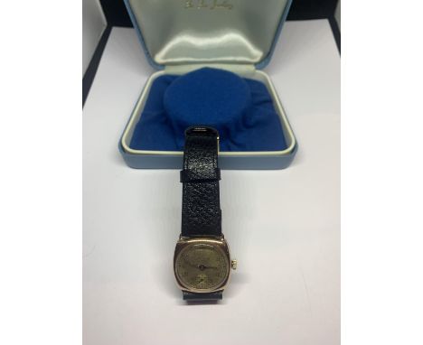 A 9 CARAT GOLD VINTAGE AUDEMARS WRIST WATCH SEEN WORKING BUT NO WARRANTY WITH A PRESENTATION BOX 