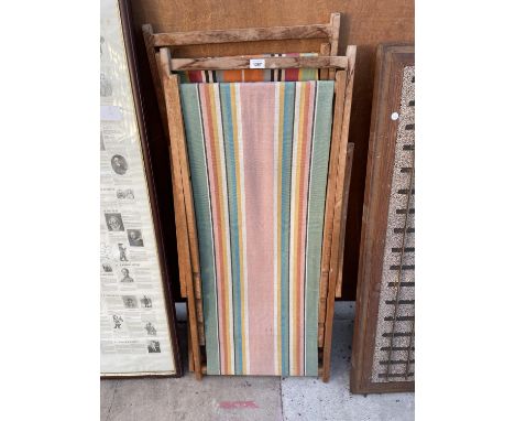 A PAIR OF VINTAGE WOODEN FOLDING DECK CHAIRS 
