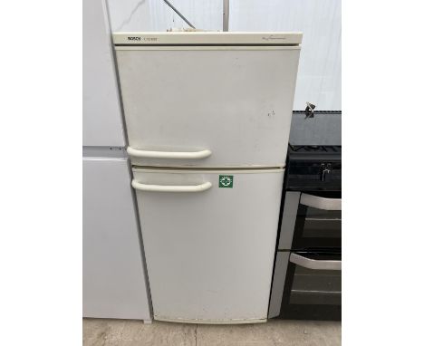 A WHITE BOSCH CLASSIX UPRIGHT FRIDGE FREEZER WITH INSTRUCTION MANUAL 