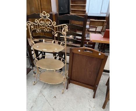 AN OVAL METALWARE THREE TIER STAND AND FIRESCREEN 