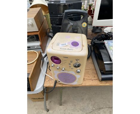 A KARAOKE MACHINE AND A MORPHY RICHARDS COMPACT STEAM 