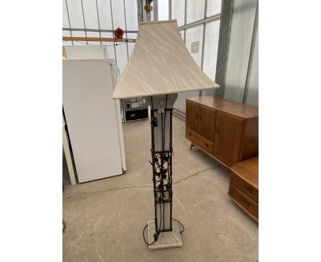 A DECORATIVE METAL STANDARD LAMP WITH SHADE 