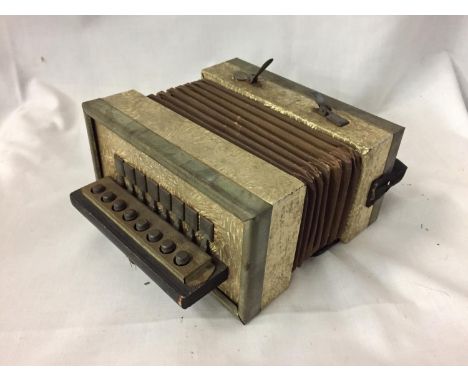 A VINTAGE SMALL GERMAN MADE ACCORDION IN WORKING ORDER BUT NO WARRANTY GIVEN 