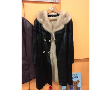 A LADIES GREEN SUEDE COAT WITH A CREAM FUR COLLAR. MADE BY M FLETCHER (MASTER FURRIER) 