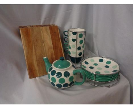 A MATCHING SET OF M&amp;S STACKING CUPS AND PLATES AND A TEAPOT 