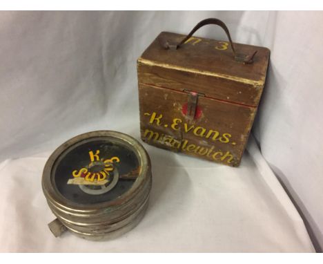 A VINTAGE RACING PIGEON CLOCK IN A WOODEN CASE WHICH BEARS THE NAME K EVANS, MIDDLEWICH ALONG WITH 'TOULET IMPERATOR' 