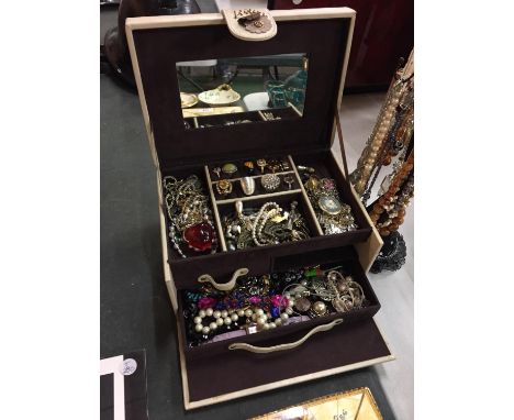 A LEATHER JEWELLERY BOX AND A MANNEQUIN CONTAINING A LARGE AMOUNT OF COSTUME JEWELLERY TO INCLUDE RINGS, NECKLACES, EARRINGS,