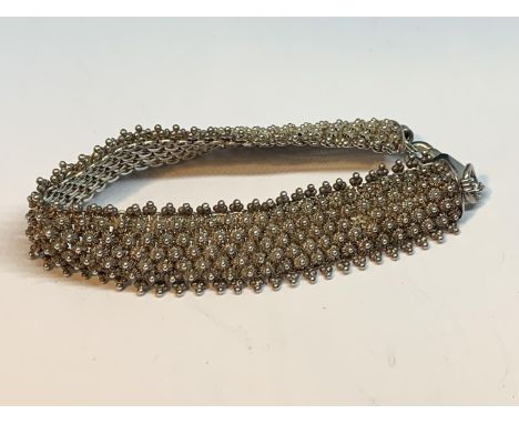 A DECORATIVE SILVER BRACELET/BANGLE 