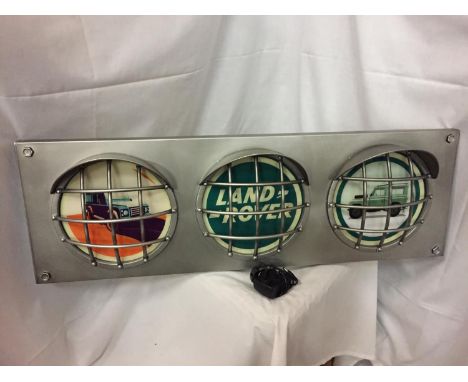 A LARGE LAND ROVER ILLUMINATED TRAFFIC LIGHT STYLE SIGN WITH HEADLIGHT DESIGN SIZE 36.5 INCHES/93CM X 12 INCHES/30CM 