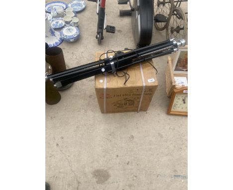 A TRIPOD BASE LAMP AND A 2 IN 1 63CC WATER PUMP 