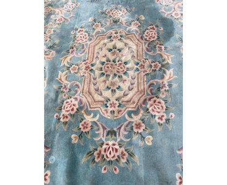 A LARGE FLORAL CHINESE CARPET, 144 X 107" (A/F) 