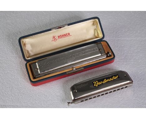 Two chromatic harmonicas made by Hohner and Bandmaster. L.22 W.6cm. (largest) 