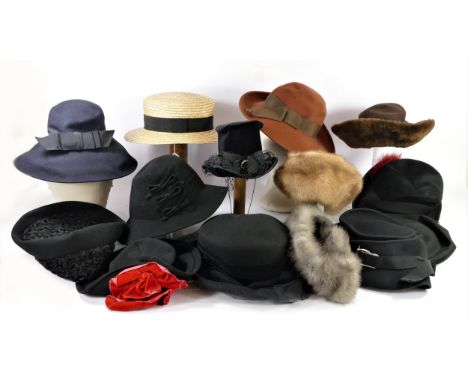 A collection of mainly black felt vintage hats with various adornments and styles with feathers, net, fabric and fur together