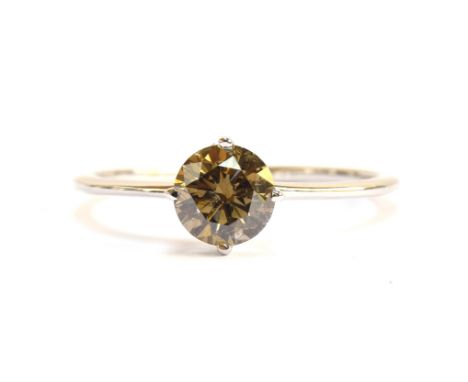 An 18ct white gold Australian diamond solitaire ring, the fancy champagne coloured diamond 1.05cts, size S, gross weight 2g 