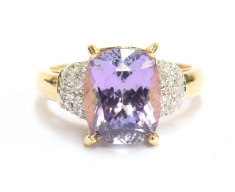 An 18ct gold pink tanzanite and diamond ring, the tanzanite 4.36cts and measuring 10.5x8.5mm, size N, gross weight 5g 