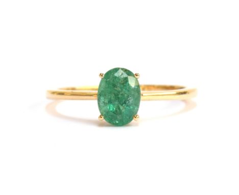 A 14ct gold and emerald solitaire ring, the oval cut Zambian emerald 1.2cts and 8x6mm, size S, gross weight 2.4g 