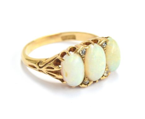 A late 19th/early 20th century 18ct gold, diamond and opal three stone ring, approx. size Q, gross weight 5.7g