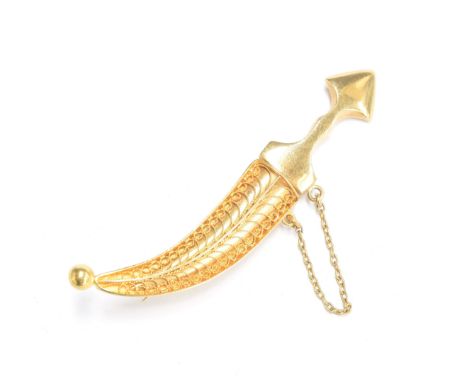 A 20th century gold Kukri brooch with filigree sheath, unmarked but tests as 14ct or higher, 5.7cm long, 7.6g 